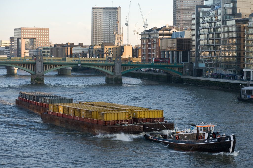 Orange or Yellow Barge That used to carry waste along London's River Thames to Mucking Marshes.